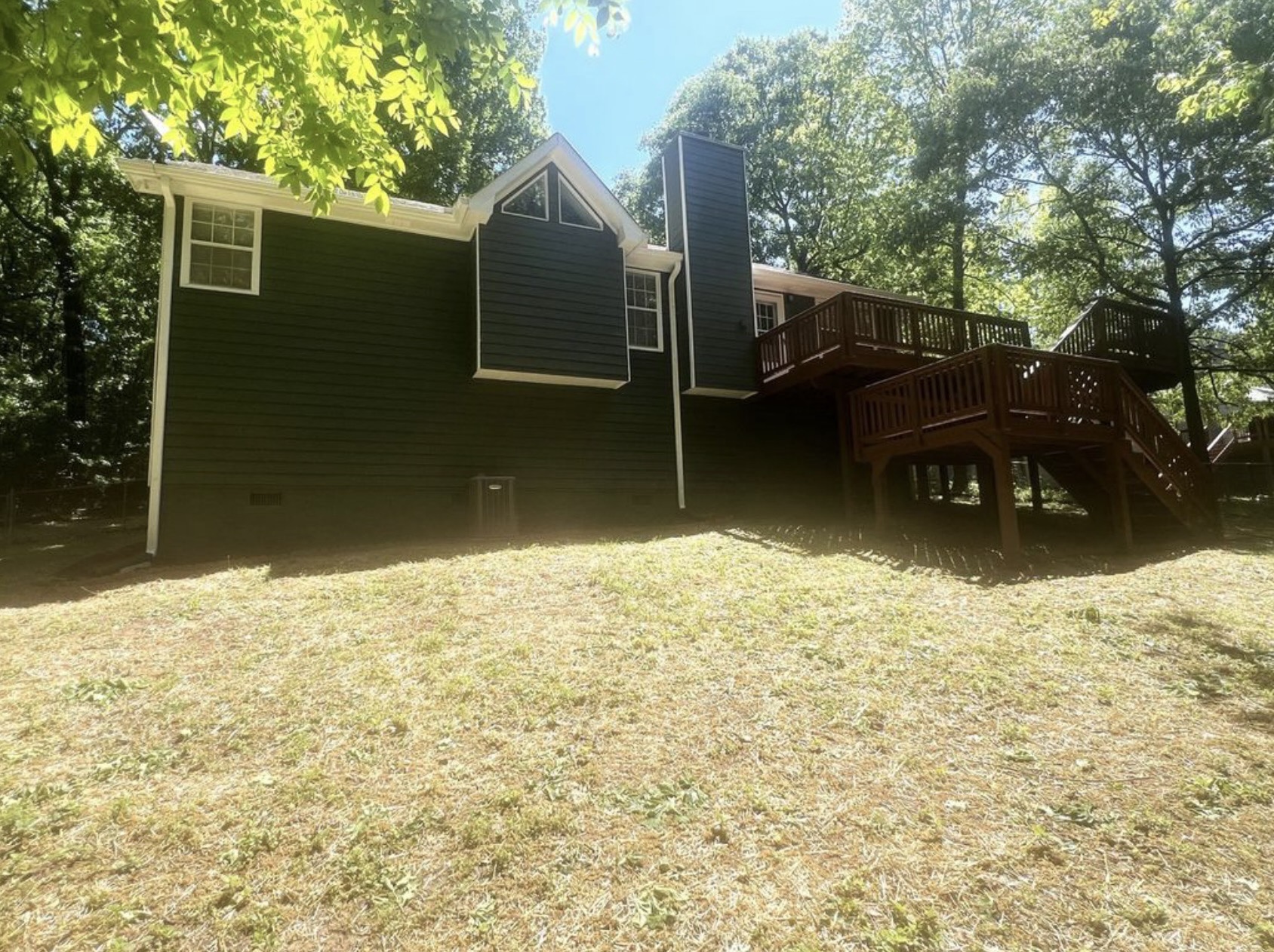 Rear exterior with fenced yard